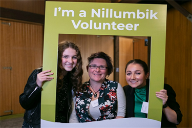 three female volunteers in frame