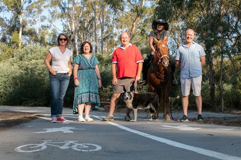 This is a photograph of Nillumbik Mayor Frances Eyre, Councillors Peter Perkins, Karen Egan and Geoff Paine and Eltham MP Vicki Ward at the Diamond Creek Trail at Hurstbridge.