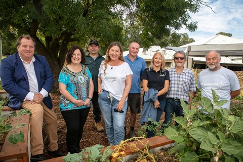 This is a photograph of local MPs, councillors and members of the Hurstbridge Men's Shed at the Edible Hub community garden