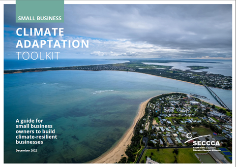 Cover of a digital toolkit showing an aerial view of a coastal town with blue water.