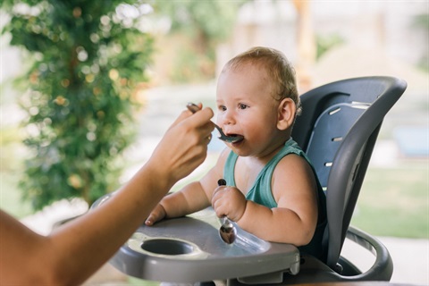 Photo of a baby in a high-chair