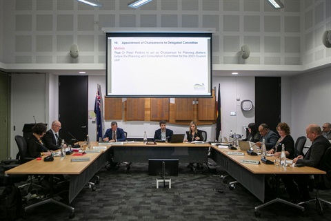 Council chamber with Councillors gathered around the tables