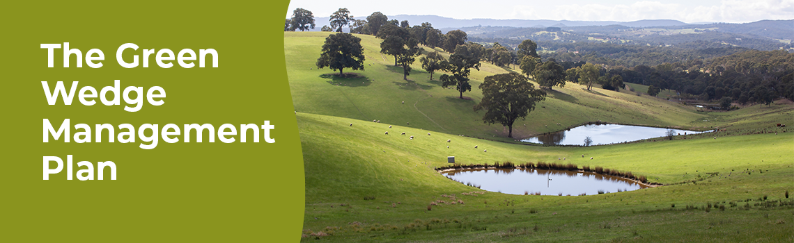 Photo of a green field with trees and a pond. Accompanying text reads 