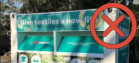 A red cross over the textile recycling bin to indicate the service has ended