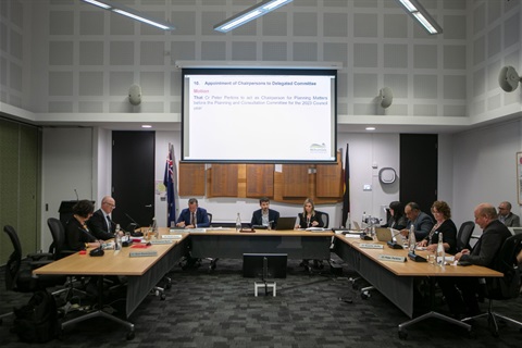 This is a photograph of a Council meeting in progress in the Council Chambers.